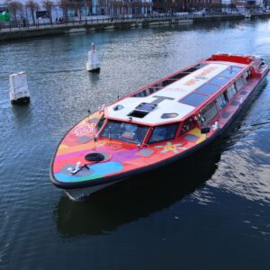 Boat cruis goiing down the river liffey